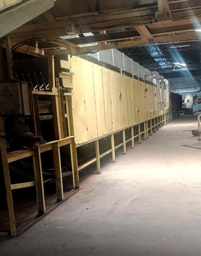 Long redrying machine running down the length of the factory