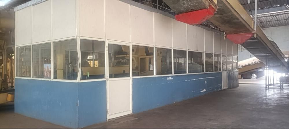 Glass-fronted control room on the factory floor
